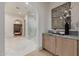 Transitional hallway leading to a large tiled shower and a dressing room at 3301 E Elm St, Phoenix, AZ 85018
