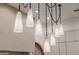 Contemporary kitchen with unique pendant lighting above the island and custom cabinetry at 3301 E Elm St, Phoenix, AZ 85018