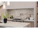 Kitchen island with marble countertop and stainless steel appliances at 3301 E Elm St, Phoenix, AZ 85018
