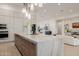 Spacious kitchen with an island, stainless steel appliances, and open layout to the living area at 3301 E Elm St, Phoenix, AZ 85018