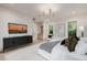 Bright bedroom with modern decor, backyard views, and a chic entertainment center at 3301 E Elm St, Phoenix, AZ 85018