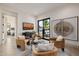 Comfortable sitting area with stylish chairs, black table, and natural light streaming in through a large window at 3301 E Elm St, Phoenix, AZ 85018