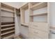 Spacious walk-in closet with custom shelving and drawer units, providing ample storage at 3301 E Elm St, Phoenix, AZ 85018