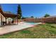 Relaxing backyard featuring a covered patio, a swimming pool, and well-maintained landscaping at 3415 E Anderson Dr, Phoenix, AZ 85032
