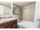 Cozy bathroom featuring a tub, toilet, vanity, and mirrored medicine cabinet for a functional and comfortable area at 3415 E Anderson Dr, Phoenix, AZ 85032