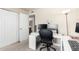 Functional bedroom featuring a large computer desk setup and a closet with mirrored doors at 3415 E Anderson Dr, Phoenix, AZ 85032