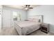 Bright bedroom featuring a ceiling fan, soft carpet, a full bed, and a window for plenty of natural light and comfortable living at 3415 E Anderson Dr, Phoenix, AZ 85032
