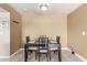A cozy dining room features neutral walls, a sleek table set, and tiled floors for a modern, inviting atmosphere at 3415 E Anderson Dr, Phoenix, AZ 85032