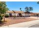 Inviting single-level home showcasing a well-maintained front yard and a two-car garage at 3415 E Anderson Dr, Phoenix, AZ 85032