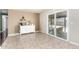 Bright living space with sliding doors to patio, coffee bar, neutral walls, and tiled floors, perfect for relaxing and entertaining at 3415 E Anderson Dr, Phoenix, AZ 85032
