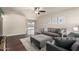 Bright living room featuring hardwood floors, a ceiling fan, neutral paint, and a view to the backyard at 3415 E Anderson Dr, Phoenix, AZ 85032