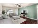 Comfortable living room featuring hardwood floors, neutral paint, and a large window at 3415 E Anderson Dr, Phoenix, AZ 85032
