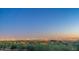 Stunning city lights view from a desert hillside in the evening at 3648 N Sky Point Cir, Mesa, AZ 85207