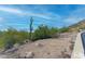 View of a desert vacant lot with Saguaro cactus, bushes, and rocky terrain at 3648 N Sky Point Cir, Mesa, AZ 85207