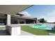 This modern home features a stylish pool, outdoor cooking area, and comfortable seating for outdoor enjoyment at 3648 N Sky Point Cir, Mesa, AZ 85207