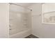Bathroom features shower/tub combo and natural light at 3713 S 54Th Ln, Phoenix, AZ 85043