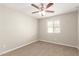 Bright bedroom features a ceiling fan and a window offering natural light at 3713 S 54Th Ln, Phoenix, AZ 85043