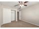 Bedroom featuring a closet with sliding doors, providing ample storage space at 3713 S 54Th Ln, Phoenix, AZ 85043