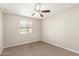 Bedroom with a window and a ceiling fan, providing natural light and comfort at 3713 S 54Th Ln, Phoenix, AZ 85043