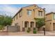 A two-story home with tan stucco, a tiled roof, desert landscaping, sidewalks and other similar houses nearby at 3713 S 54Th Ln, Phoenix, AZ 85043