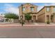 Two-story home with brown stucco, a tile roof, desert landscaping and simple architectural details at 3713 S 54Th Ln, Phoenix, AZ 85043