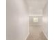 Hallway leads to carpeted room with natural light at 3713 S 54Th Ln, Phoenix, AZ 85043