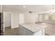 Open-concept living area with island and multiple doors at 3713 S 54Th Ln, Phoenix, AZ 85043