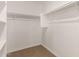 Walk-in closet provides ample storage with built-in shelving and clothing rods at 3713 S 54Th Ln, Phoenix, AZ 85043