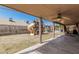 View of the backyard with a playset and covered patio, perfect for outdoor entertaining at 4207 W Soft Wind Dr, Glendale, AZ 85310