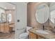 Bathroom offers dual sinks, granite counters, and a toilet with safety handle at 4207 W Soft Wind Dr, Glendale, AZ 85310