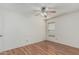 Empty bedroom with wood-style floors, a ceiling fan, and natural light at 4207 W Soft Wind Dr, Glendale, AZ 85310