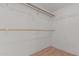 Empty closet with multiple shelves and wood-style flooring at 4207 W Soft Wind Dr, Glendale, AZ 85310
