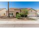 Charming single-story home with a desert-landscaped front yard and solar panels on the roof at 4207 W Soft Wind Dr, Glendale, AZ 85310