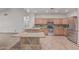 Open concept kitchen showcases granite countertops, stainless appliances and a breakfast bar at 4207 W Soft Wind Dr, Glendale, AZ 85310