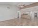 Open concept living room showcases high ceilings, neutral colors and smooth tiled flooring at 4207 W Soft Wind Dr, Glendale, AZ 85310