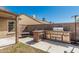 Outdoor kitchen with stainless steel grill, sink, and countertop space for outdoor entertaining at 4207 W Soft Wind Dr, Glendale, AZ 85310