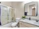 Bathroom featuring granite countertops, sliding shower door, and vanity mirror at 4234 E Narrowleaf Dr, Gilbert, AZ 85298
