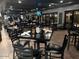 Dark, modern dining area provides a stylish and inviting space for residents to enjoy with friends and Gathering at 4234 E Narrowleaf Dr, Gilbert, AZ 85298