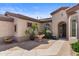 Inviting front entrance featuring a charming water fountain and well-manicured landscaping at 4234 E Narrowleaf Dr, Gilbert, AZ 85298