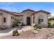 Charming front exterior featuring a water fountain, desert landscaping, and inviting curb appeal at 4234 E Narrowleaf Dr, Gilbert, AZ 85298