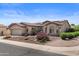 Inviting single-story home showcasing desert landscaping, solar panels and a neutral-toned exterior at 4234 E Narrowleaf Dr, Gilbert, AZ 85298