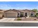Charming single-story home with a tiled roof, desert landscaping, two-car garage, and welcoming front entrance at 4234 E Narrowleaf Dr, Gilbert, AZ 85298