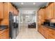 Bright kitchen with stainless steel refrigerator and ample counter space, connecting to the living area at 4234 E Narrowleaf Dr, Gilbert, AZ 85298