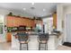 Eat-in kitchen features wood cabinets, granite countertops, and stainless steel appliances at 4234 E Narrowleaf Dr, Gilbert, AZ 85298