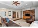 Bright living area featuring tile flooring, a custom entertainment center, and neutral paint at 4234 E Narrowleaf Dr, Gilbert, AZ 85298