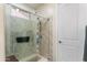 Walk-in shower with marble surround, multiple shower heads, and built-in bench at 4234 E Narrowleaf Dr, Gilbert, AZ 85298