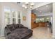 Comfortable sitting area features a large couch and natural light from the window at 4234 E Narrowleaf Dr, Gilbert, AZ 85298