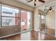 Bedroom featuring mirrored closet, wood floors, and large windows with neighborhood views at 4617 E Culver St, Phoenix, AZ 85008
