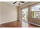 Bedroom featuring neutral walls, wood floors, and large windows with neighborhood views at 4617 E Culver St, Phoenix, AZ 85008