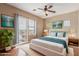 Bright bedroom featuring a large window, hardwood floors, and a serene color palette at 4617 E Culver St, Phoenix, AZ 85008